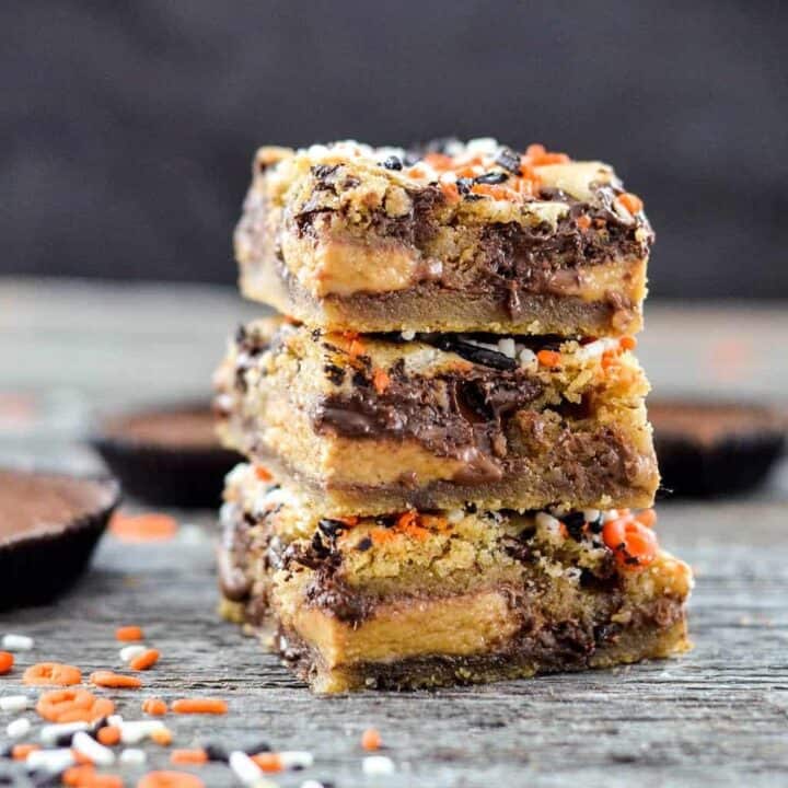 55 Easy Halloween Party Food Ideas That Everyone Will Love   Candy Stuffed Chocolate Chip Cookie Bars 6 720x720 